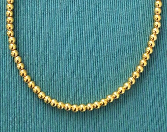 45 cm necklace in golden natural hematite beads