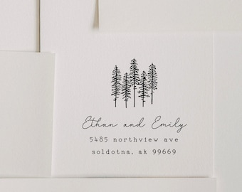 May include: Black and white illustration of a group of pine trees. Text below reads "Ethan and Emily", "5485 northview ave", "soldotna, ak 99669".
