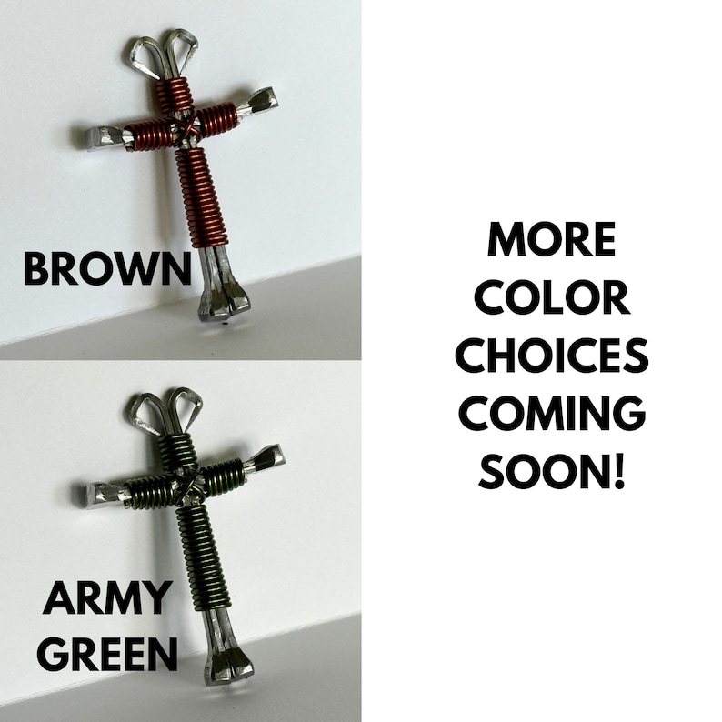 May include: Two handmade crosses made from horseshoes and wire. The top cross is brown and the bottom cross is army green.