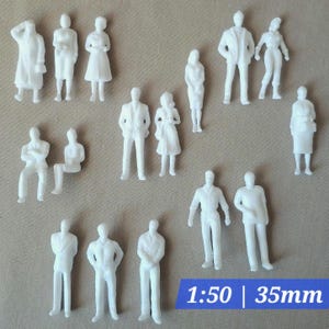 May include: A collection of small, white plastic figures of people in various poses. Some figures are standing, others are sitting. The image includes the text "1:50 | 35mm". These figures are likely used for architectural models or dioramas.