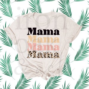 May include: A beige t-shirt with the word "Mama" printed four times in black, yellow, pink, and leopard print.
