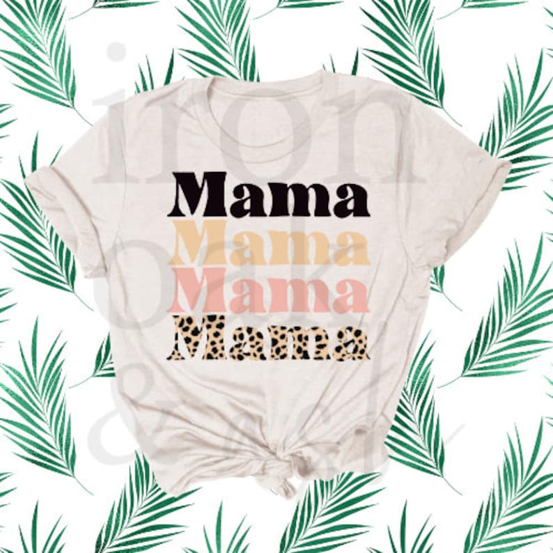 May include: A beige t-shirt with the word "Mama" printed four times in black, yellow, pink, and leopard print.
