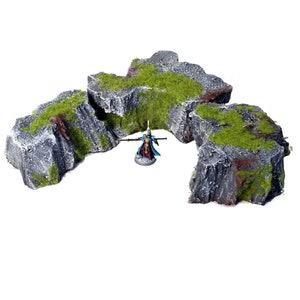 Hand painted tabletop/wargame rock terrain from Mystic Pigeon Gaming. Avalible in different sizes and styles.