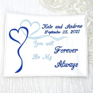 May include: White embroidered patch with two blue hearts and the text "Kate and Andrew September 25, 2021 You will be my Forever Always".