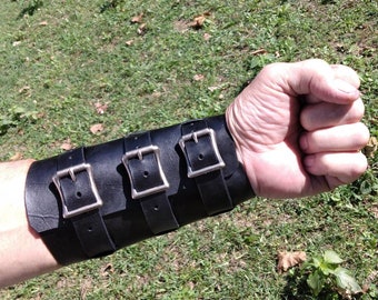 Leather forearm / wrist cuff, extra wide.  6" wide 7 1/2" long at the wrist diameter with three 3/4" buckle bands.