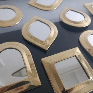 Set of small golden mirrors wall decoration