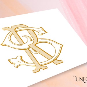 May include: A gold monogram with the letters "R" and "S" intertwined in a decorative, ornate style. The letters are stylized with flourishes and intricate details.