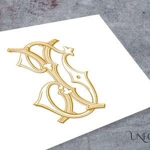 May include: A gold-colored monogram with the letters "S" and "F" intertwined in a decorative, stylized font.