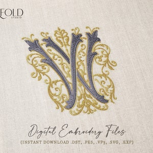 May include: A digital embroidery file of a stylized letter W with gold and gray floral designs. The file is available for instant download in DST, PES, VP3, SVG, and EXP formats.