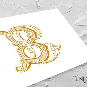 Può includere: Un monogramma iniziale "B" dorato con fioriture ornate e un motivo floreale decorativo.
