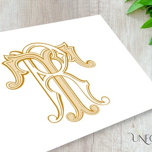 May include: A gold monogram with the letters "R" and "R" intertwined in a decorative, ornate font.