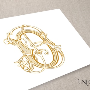 Könnte beinhalten: Ein goldenes Monogramm mit einem dekorativen Schnörkeldesign. Das Monogramm hat die Form des Buchstabens "A" mit einem stilisierten floralen Design.