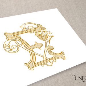 May include: A gold-colored monogram with the letter "F" in a decorative, ornate font. The letter is surrounded by intricate floral designs.