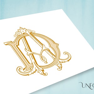 Puede incluir: Diseño de monograma dorado con las letras "D" y "A" entrelazadas en un marco ornamentado. El diseño incluye elementos florales y de volutas, sobre un fondo blanco. El logotipo "Unfold Studio" está en la esquina inferior derecha.