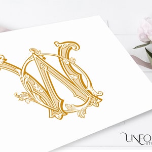 May include: A gold monogram with the letters "W" and "W" intertwined in a decorative, ornate style. The letters are surrounded by intricate flourishes and scrolls.