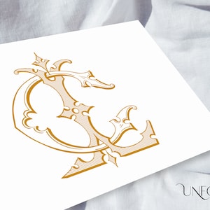 May include: A gold-colored, ornate, decorative letter C with intricate details and a stylized design.