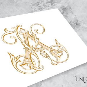 May include: An ornate, decorative letter A in gold, with intricate swirls and flourishes.