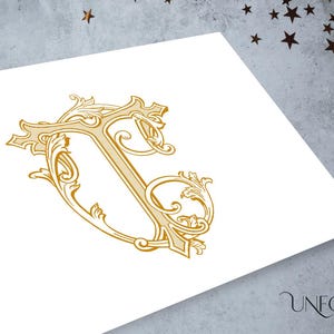 May include: A gold monogram with the letters "T" and "C" intertwined in a decorative, ornate font. The letters are surrounded by intricate floral designs.