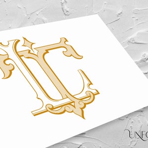 May include: A gold monogram with the letters "LC" in a decorative, ornate font. The letters are intertwined and have a 3D effect.
