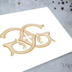 May include: Gold-colored monogram with the letters "SG" in an ornate, vintage style. The design is printed on a white surface, with the "UNFOLD STUDIO" logo in the bottom right corner. The background is a textured gray with star-shaped confetti.