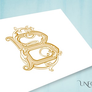 May include: A gold-colored, ornate, decorative letter B with intricate flourishes and swirls.