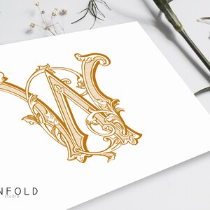 May include: A gold-colored monogram featuring the intertwined letters "W" and "N" in an ornate, vintage style. The design is set against a white background, with the word "UNFOLD" and "studio" printed below the monogram.