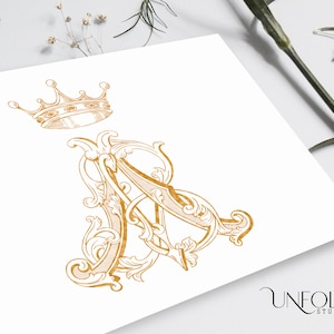 May include: A gold crown sits above a gold monogram of the letters "A" and "A" intertwined with ornate flourishes. The letters are in a vintage style and the design is on a white background. The text "UNFOLD STUDIO" is at the bottom of the image.