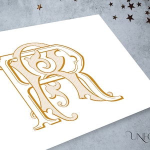 May include: A gold monogram with the letters "R" and "R" intertwined in a decorative, ornate style. The letters are stylized with flourishes and swirls.