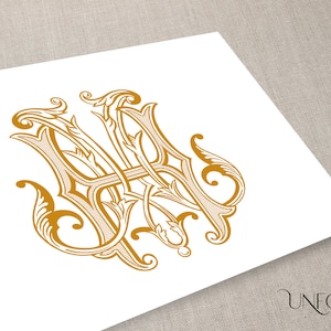 May include: A gold monogram with the letters "M" and "A" intertwined with ornate floral designs.