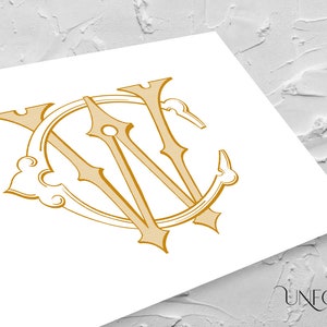 May include: A gold monogram with the letters "WC" intertwined in a circular design. The letters are stylized with a decorative flourish.
