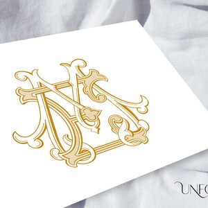 May include: A gold monogram with the letters "M" and "N" intertwined in a decorative, ornate style.