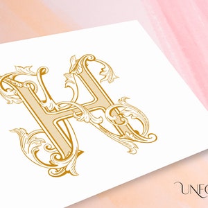 May include: A gold-colored, ornate, decorative letter H with intricate flourishes and swirls.