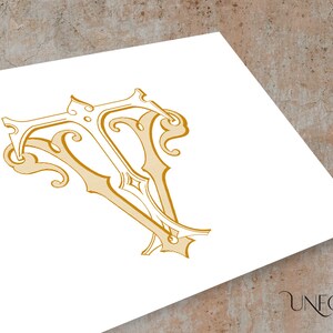 May include: A gold-colored, ornate, decorative letter "V" with intricate flourishes and swirls.