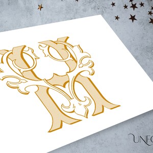 May include: Gold-colored monogram design featuring the letters "YM" intertwined with ornate floral elements. The design is set against a white background, with the "UNFOLD STUDIO" logo in the bottom right corner.
