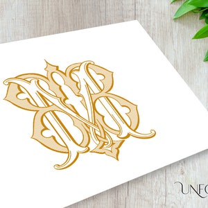 Pode incluir: Um monograma dourado com as letras "M" e "B" entrelaçadas em um estilo decorativo e ornamentado.