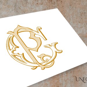 Puede incluir: Un monograma dorado con las letras "P" y "S" entrelazadas en un diseño circular decorativo.