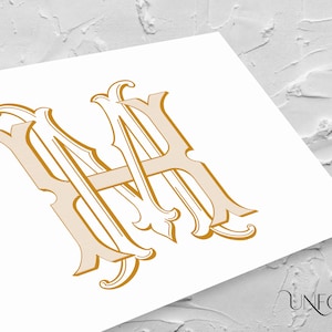 May include: A gold-colored monogram design featuring the intertwined letters "A" and "H" in an ornate, vintage style. The design is printed on a white surface, with the "UNFOLD STUDIO" logo in the bottom right corner.