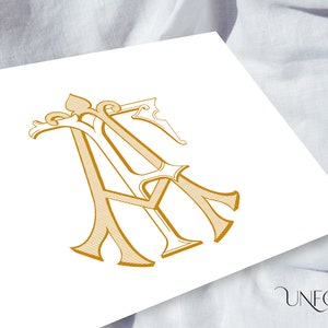 Puede incluir: Un diseño de monograma dorado con las letras 'A' y 'F' entrelazadas en un estilo elegante y ornamentado. El diseño está sobre un fondo blanco, con las palabras "UNFOLD STUDIO" en una fuente de escritura en la esquina inferior derecha.