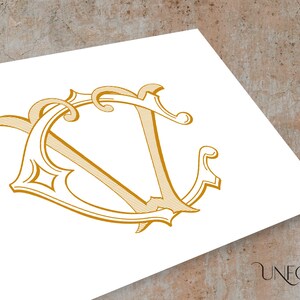May include: A gold monogram with the letters "V" and "V" intertwined in a decorative, stylized font.
