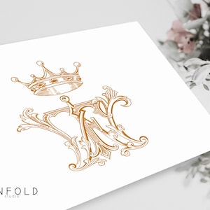 May include: A gold monogram with a crown above it. The monogram is a stylized "M" with ornate flourishes. The crown is detailed with jewels and has a pointed top. The image is on a white background with the text "UNFOLD studio" at the bottom.