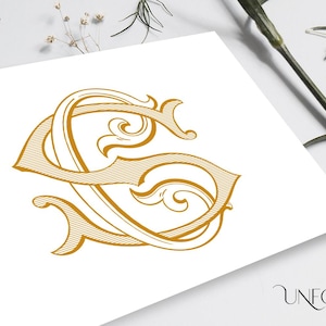 May include: A gold monogram with the letter "S" in a decorative, ornate font. The letter is surrounded by intricate flourishes and swirls.