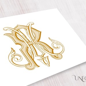 May include: Gold monogram design featuring the intertwined letters 'R' and 'A' in an ornate, vintage style. The design includes decorative flourishes and is set against a white background. The Unfold Studio logo is in the bottom right corner.