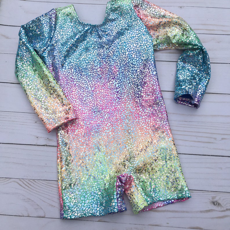 Gymnastics biketard with long sleeves in pastel tie dye overlayed with sparkly silver.