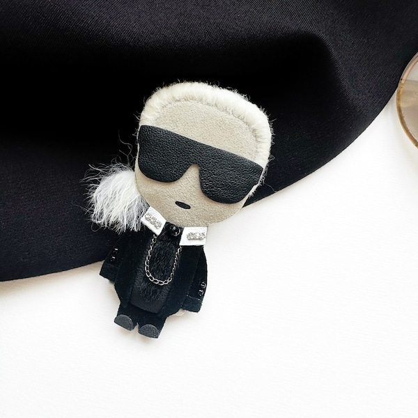 Karl Lagerfeld brooch black fashion designer gift man in suit