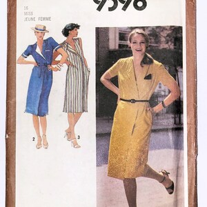 May include: Simplicity sewing pattern number 9398 for a dress. The pattern is for misses sizes 16. The pattern shows three different styles of dresses, one in blue, one in striped fabric, and one in yellow.