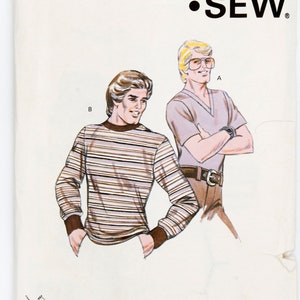 Könnte beinhalten: Ein Schnittmuster für zwei langärmelige Hemden. Das Schnittmuster heißt "Kwik-Sew" und die Schnittmuster-Nummer ist 1003. Das Schnittmuster umfasst die Größen S, M, L und XL.