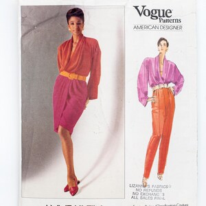 May include: Vogue Patterns American Designer sewing pattern for a dress and trousers by Anne Klein. The pattern is for a very easy project and includes instructions for making a wrap dress and wide-leg trousers. The pattern number is 2438.
