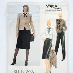 May include: A sewing pattern for a women's suit by Bill Blass, Vogue Patterns American Designer, pattern number 2764. The pattern includes a jacket, skirt, and blouse.
