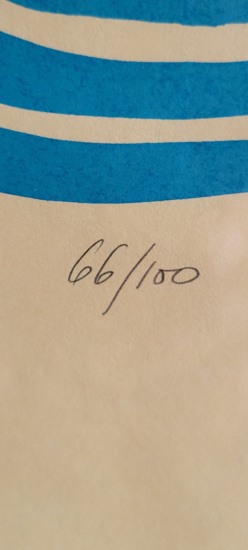 May include: Artwork print with blue and white horizontal stripes at the top. The print is numbered 66/100 in black ink on a beige background. The artwork has a minimalist design.