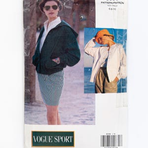 May include: A vintage Vogue Sport sewing pattern for a jacket and skirt. The pattern number is 8096 and the size is 6-8-10. The pattern features a woman wearing a green jacket and a striped skirt.